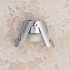 French Champagne Bottle Stopper on a beige background at Addison West