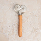 Pastry Cutter & Crimper on a beige background at Addison West