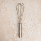 9.5 Inch Ballon Whisk on a beige background at Addison West