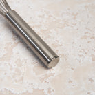 9.5 Inch Ballon Whisk on a beige background at Addison West