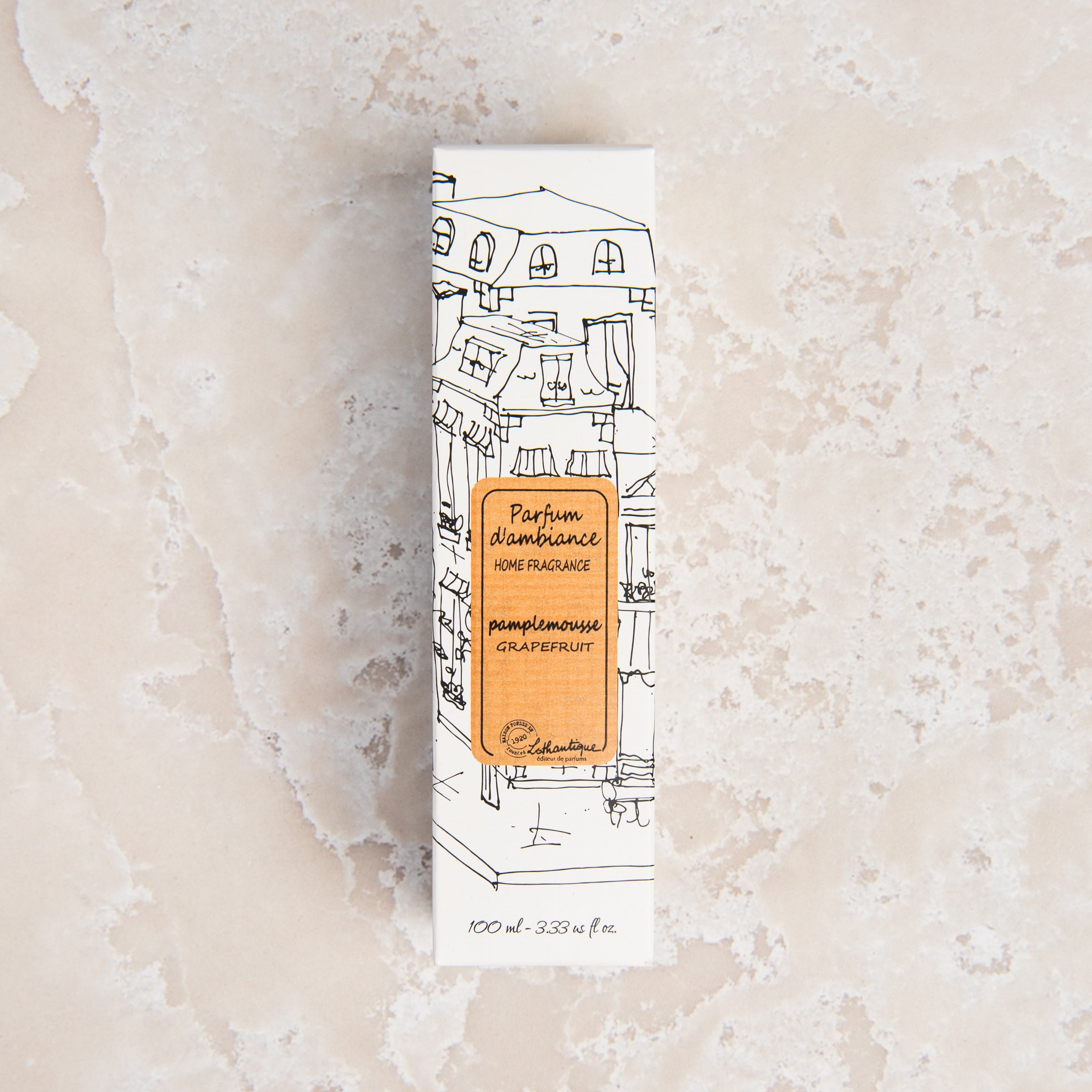Lothantique Grapefruit Room Spray on a beige background at Addison West