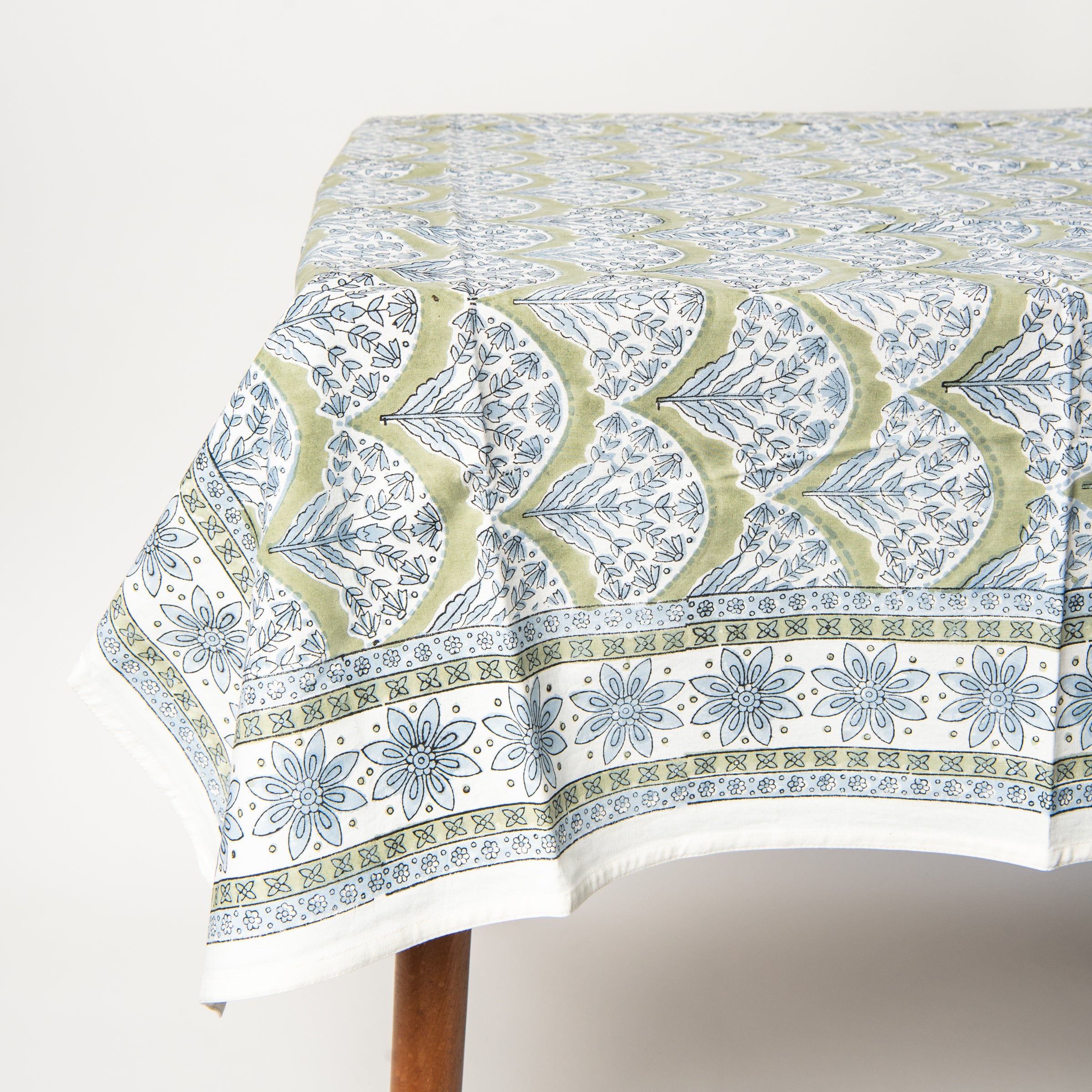 Summer Sage Block Print Tablecloth on a table at Addison West