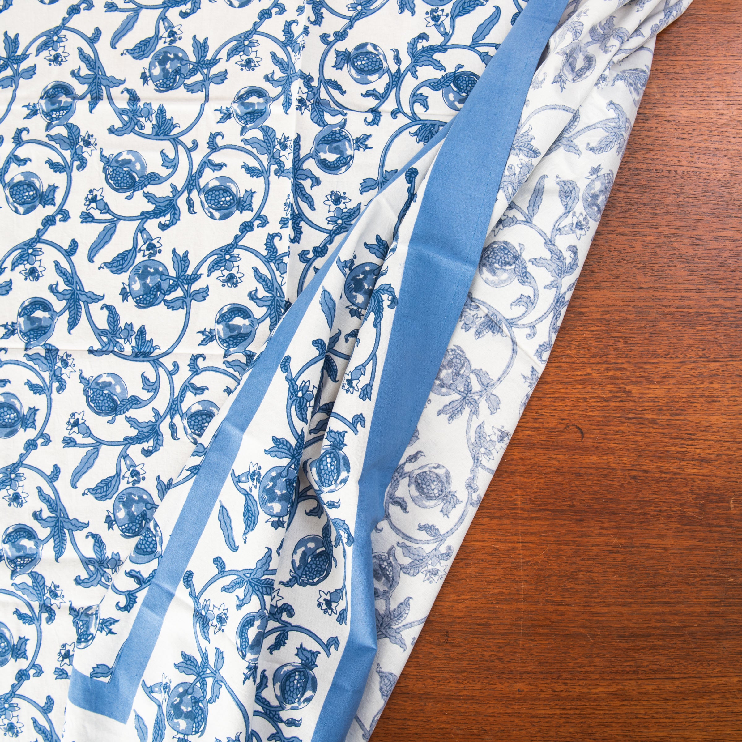 Granada Cornflower Tablecloth 59" x 59" on a table at Addison West