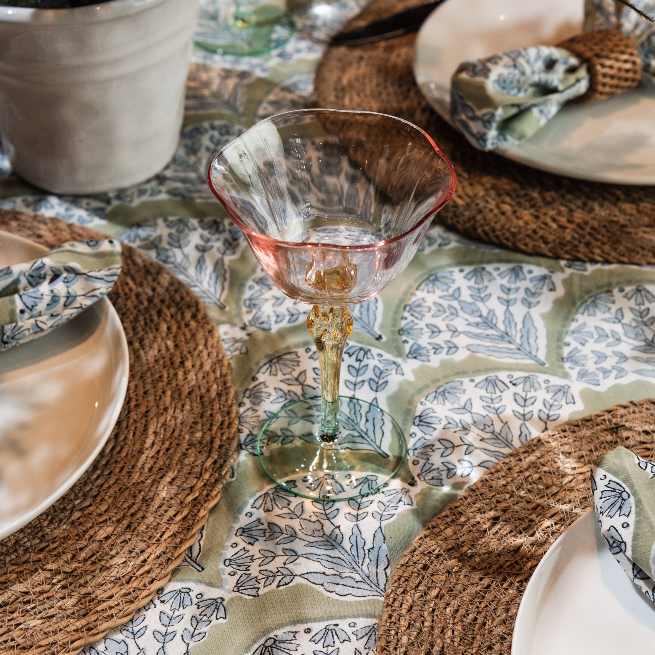 Tulip Stem Spring Glasses, Set of 6 on a table at Addison West