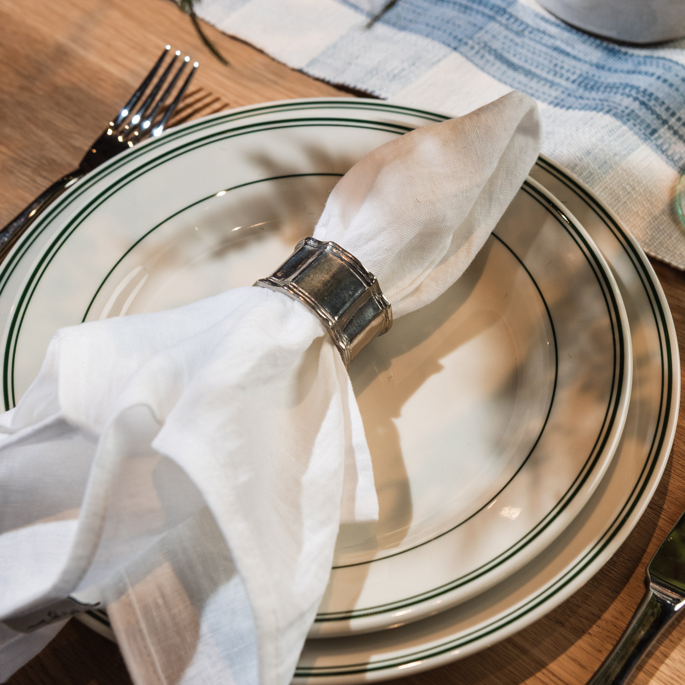 Classic Pewter Napkin Rings, Set of 4 on a table at Addison West