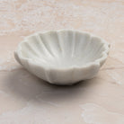 Dona Marble Bowl on a stone table at Addison West