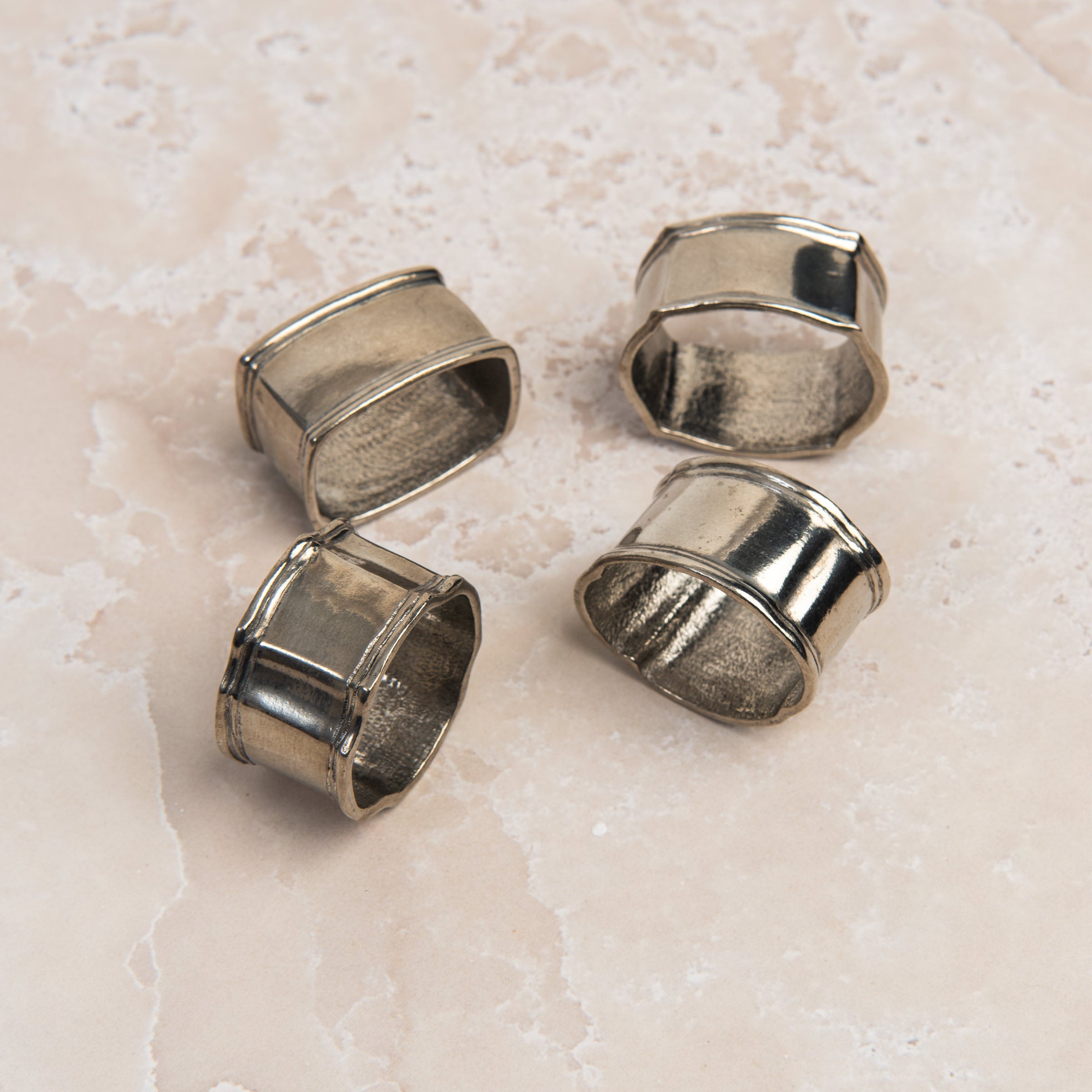 Classic Pewter Napkin Rings, Set of 4 on a table at Addison West