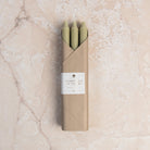 12" Taper Candles in Sage Green, Set of 6 on a table at Addison West