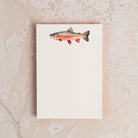 Rainbow Trout Notepad on a table at Addison West
