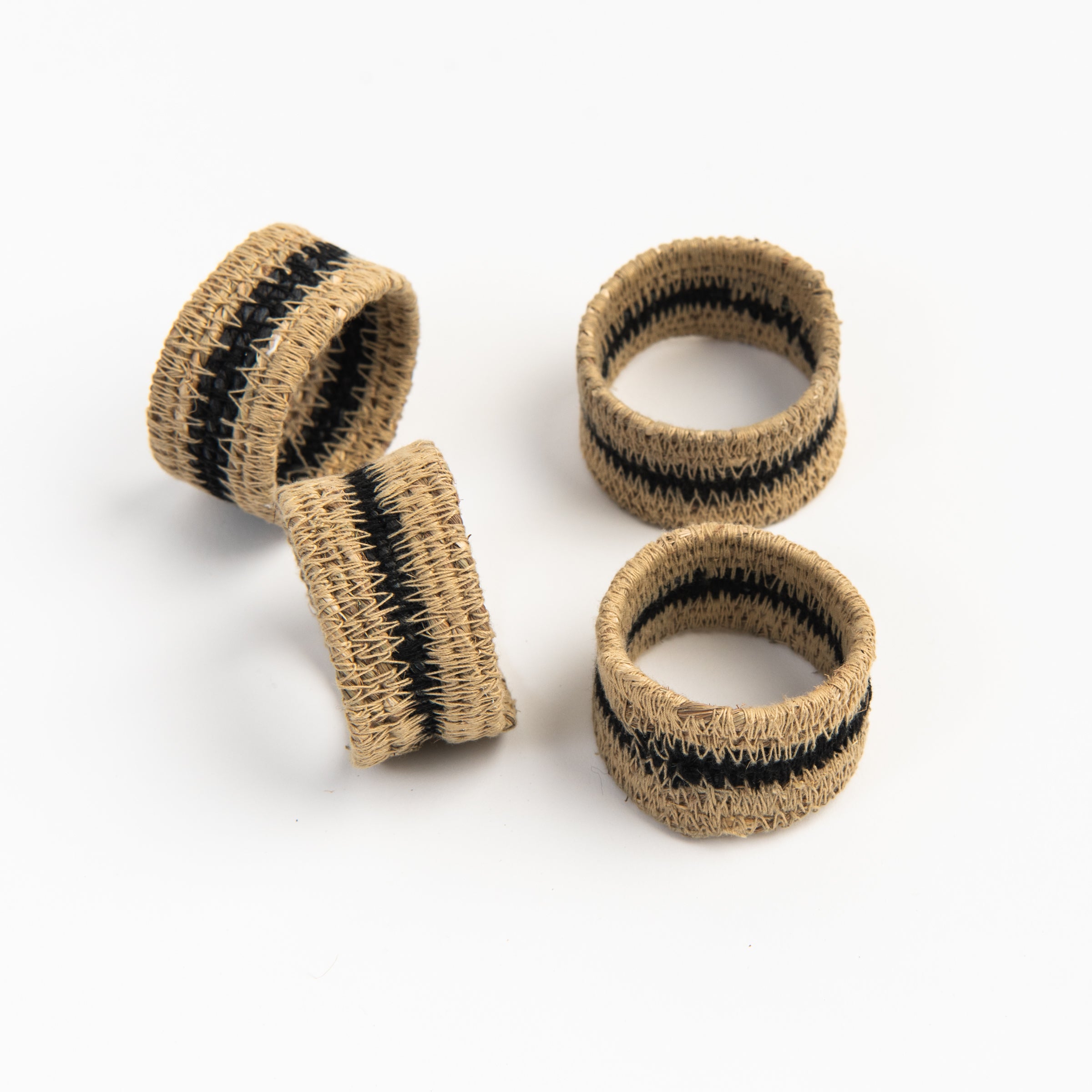 Black Seagrass Napkin Rings, Set of 4 on a white background at Addison West