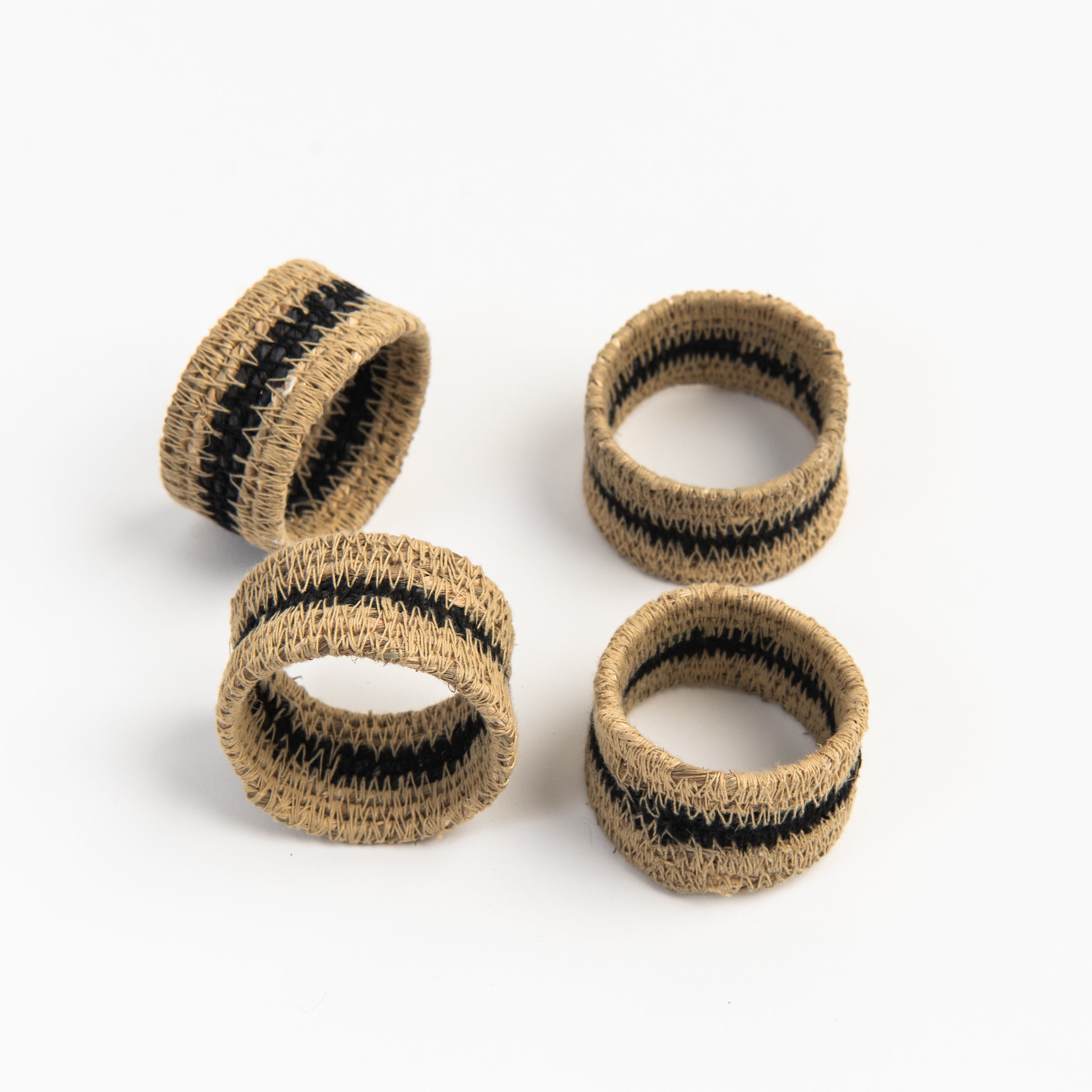 Black Seagrass Napkin Rings, Set of 4 on a white background at Addison West