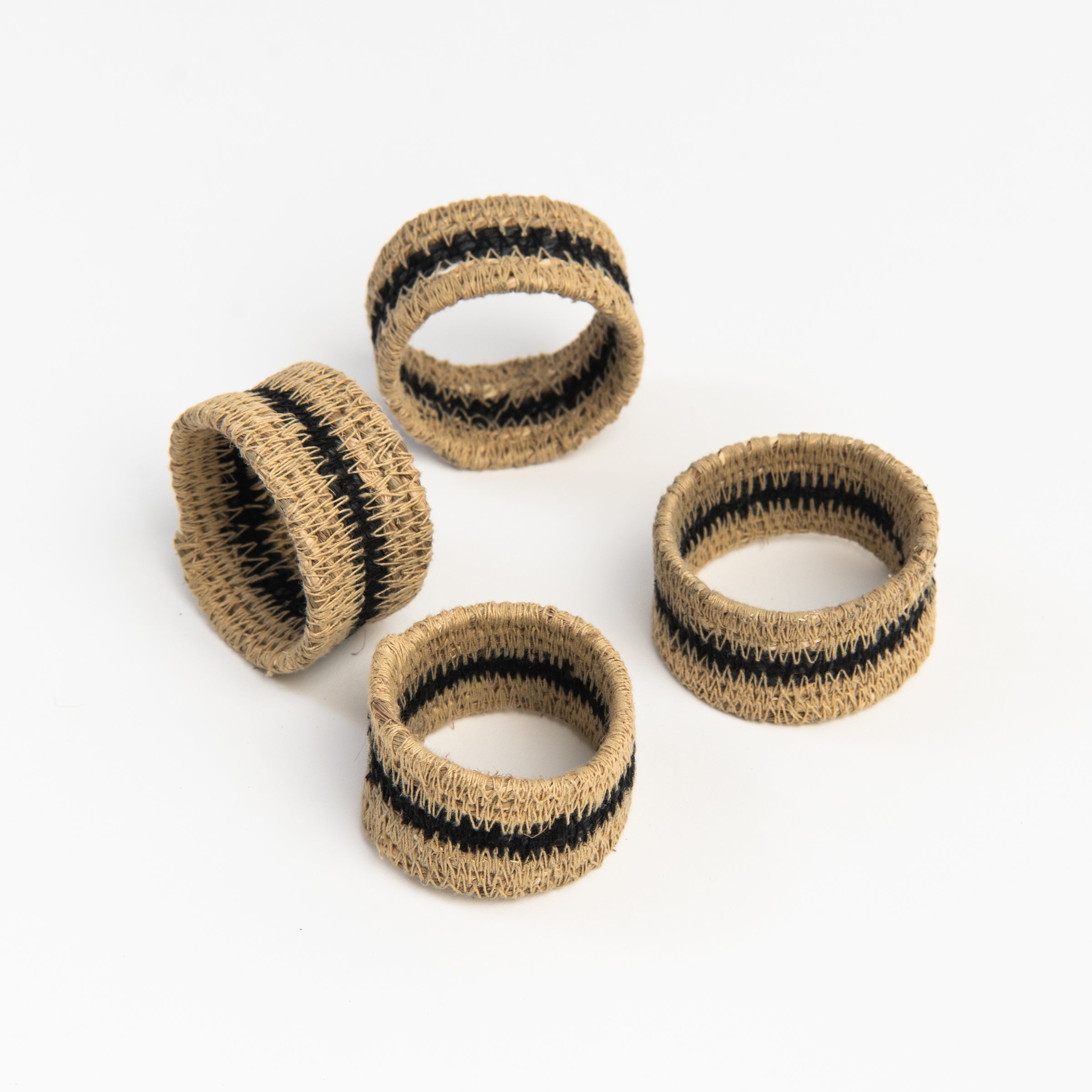 Black Seagrass Napkin Rings, Set of 4 on a white background at Addison West