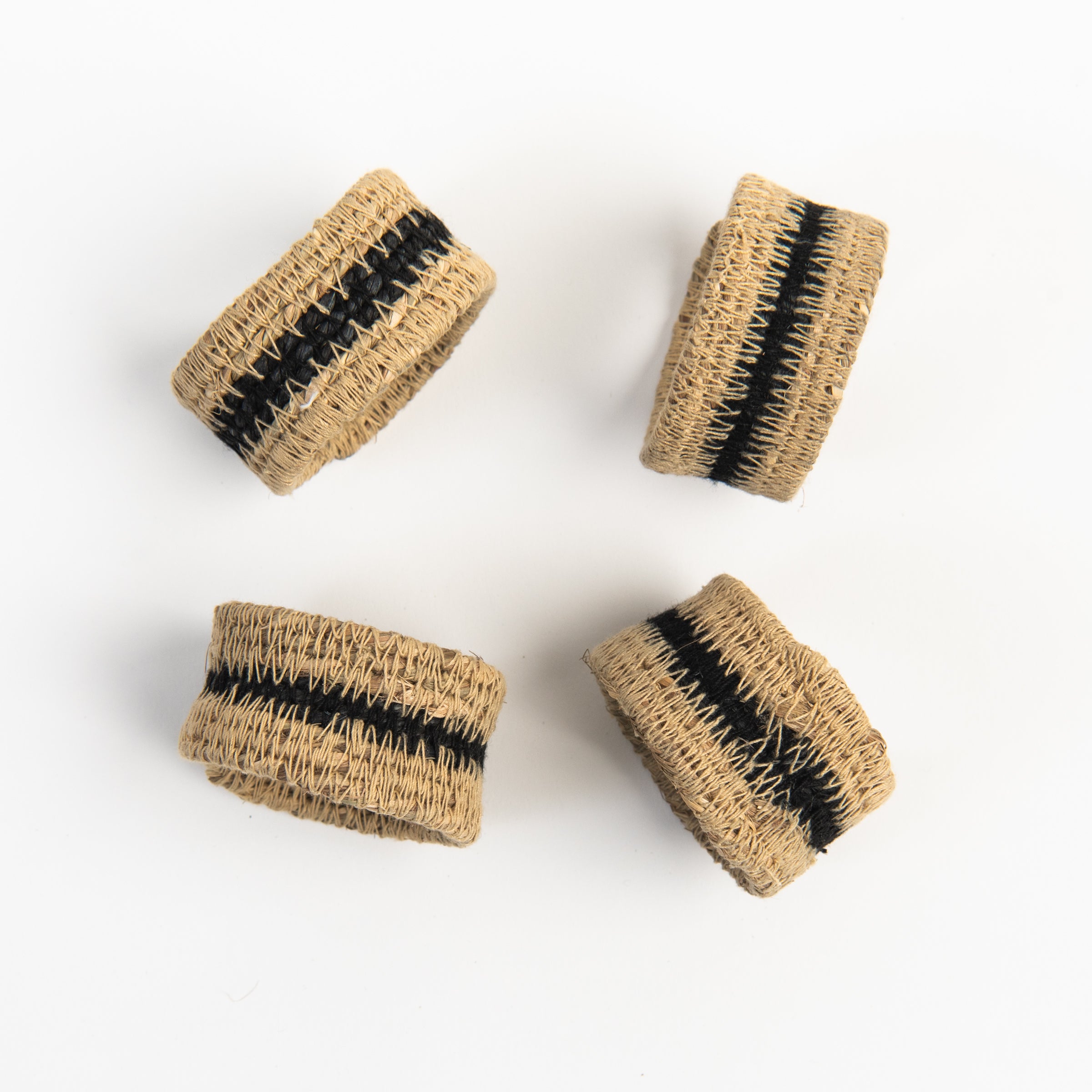 Black Seagrass Napkin Rings, Set of 4 on a white background at Addison West