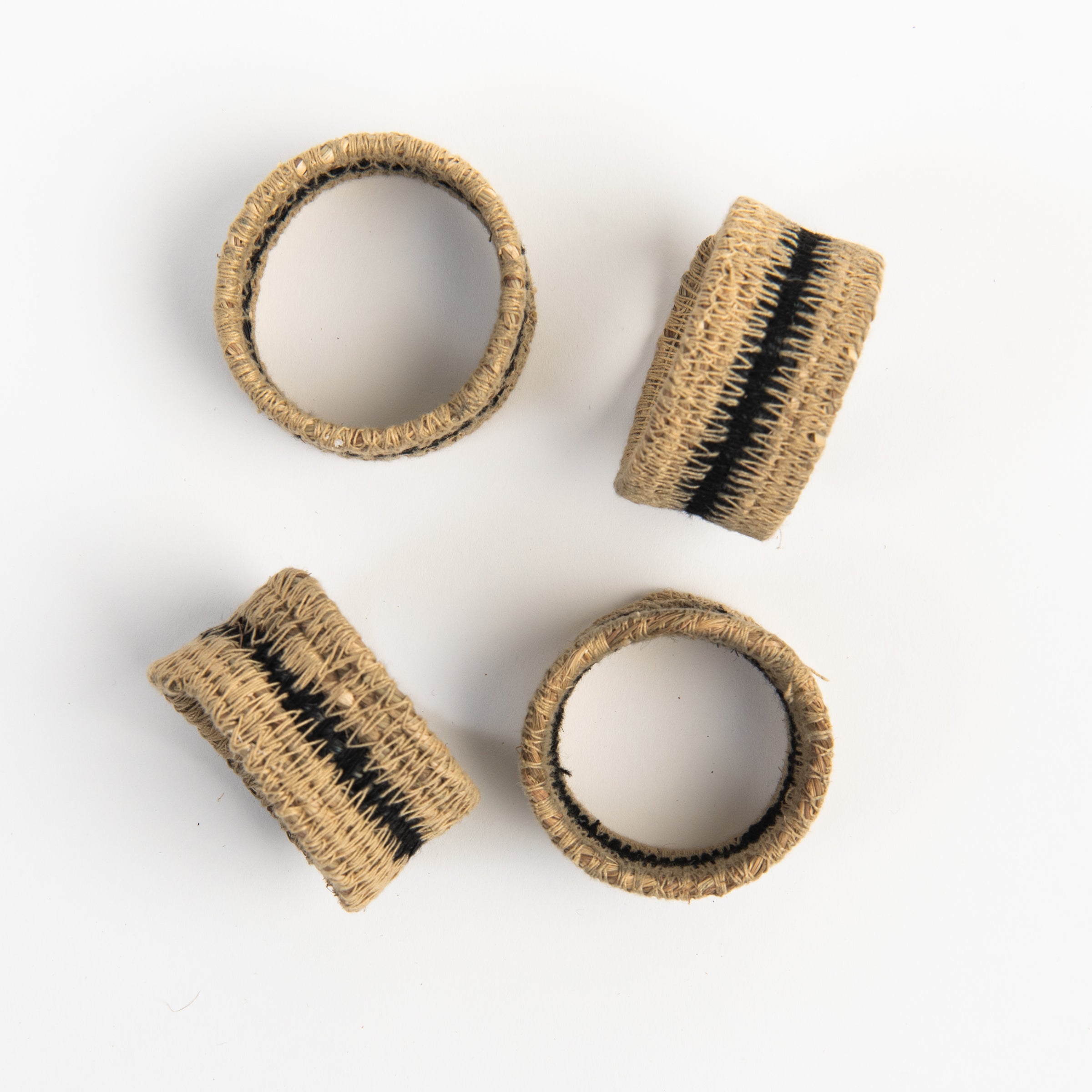 Black Seagrass Napkin Rings, Set of 4 on a white background at Addison West