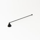 Black metal Candle Snuffer on a white background at Addison West