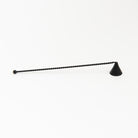 Black metal Candle Snuffer on a white background at Addison West