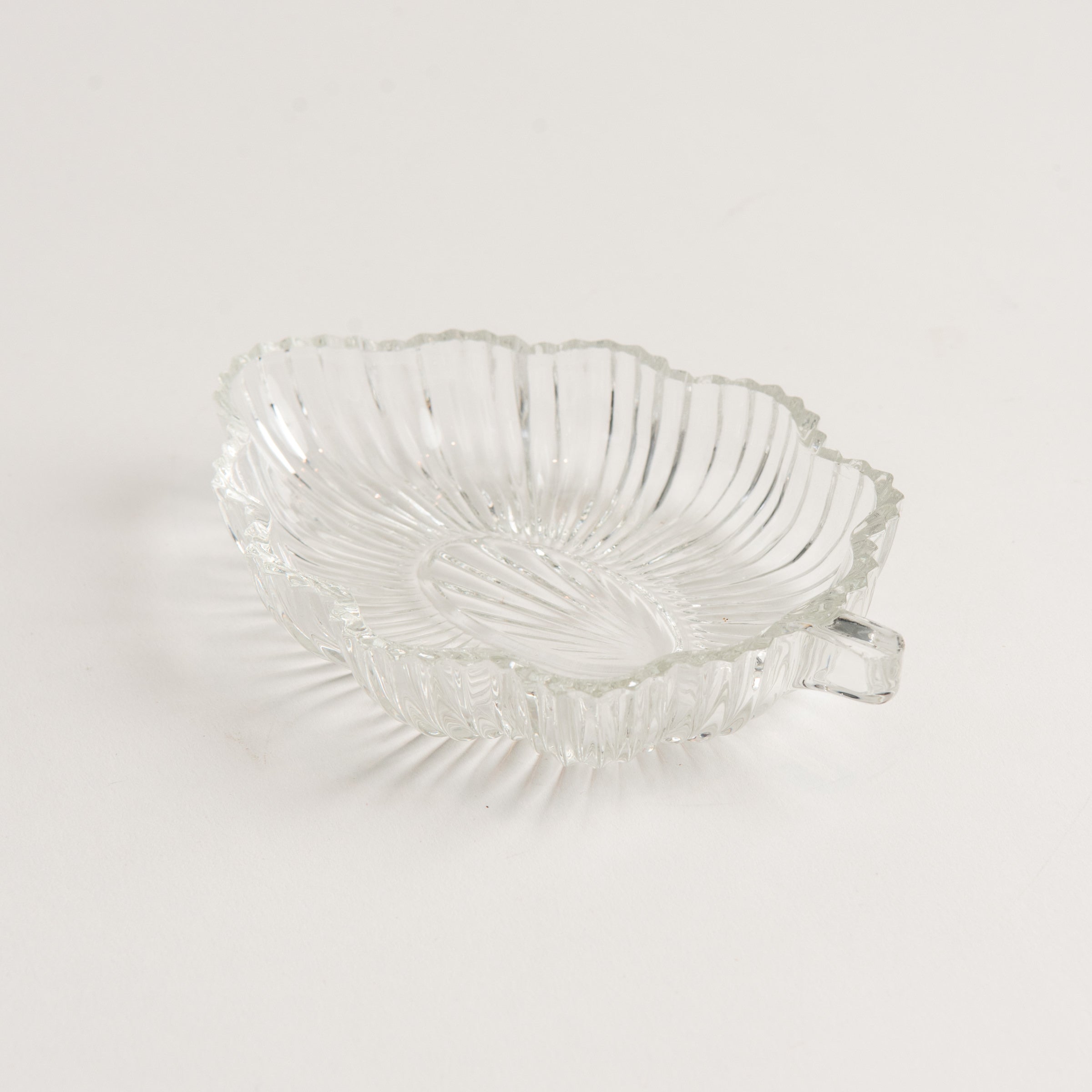 Vintage 30s Glass Leaf Dish on a white background at Addison West