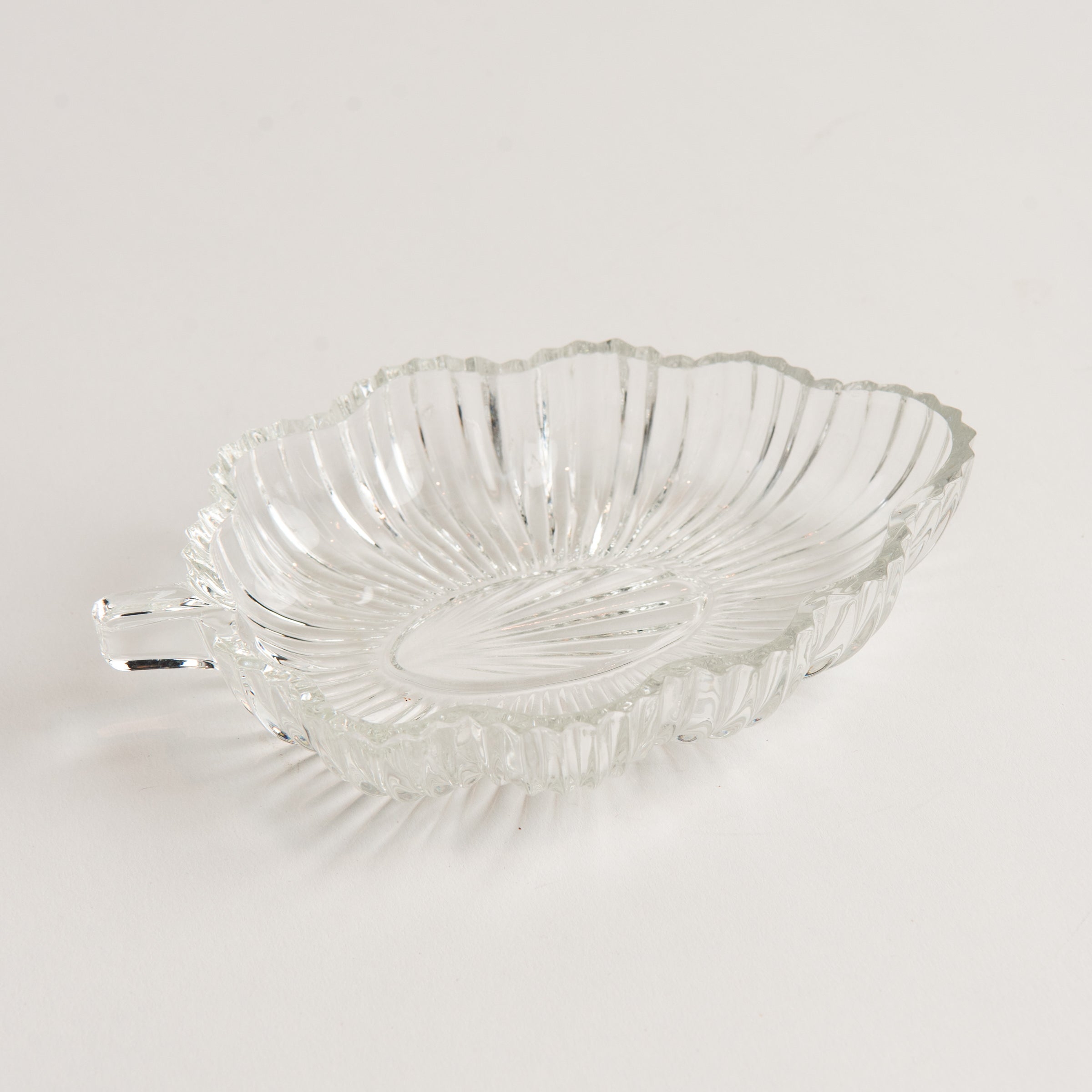 Vintage 30s Glass Leaf Dish on a white background at Addison West