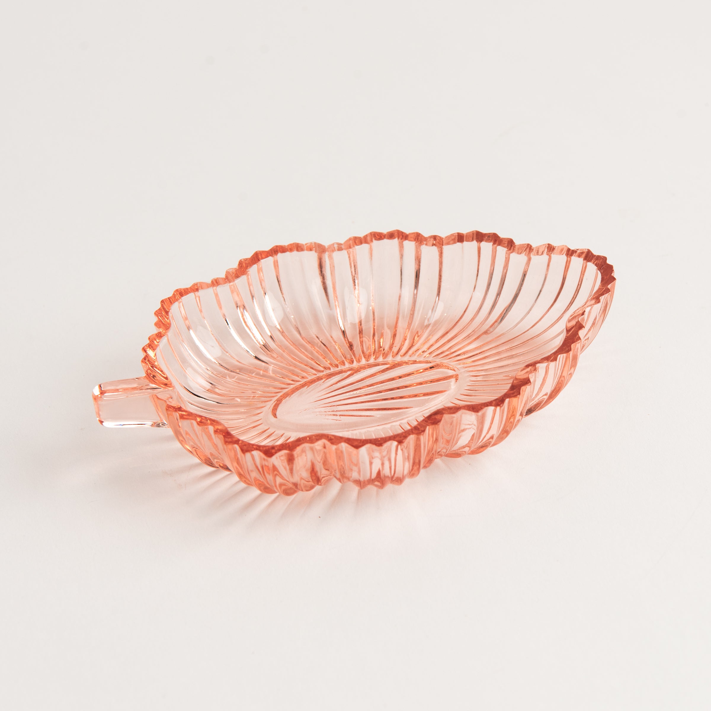Vintage 30s Glass Leaf Dish in Blush on a white background at Addison West