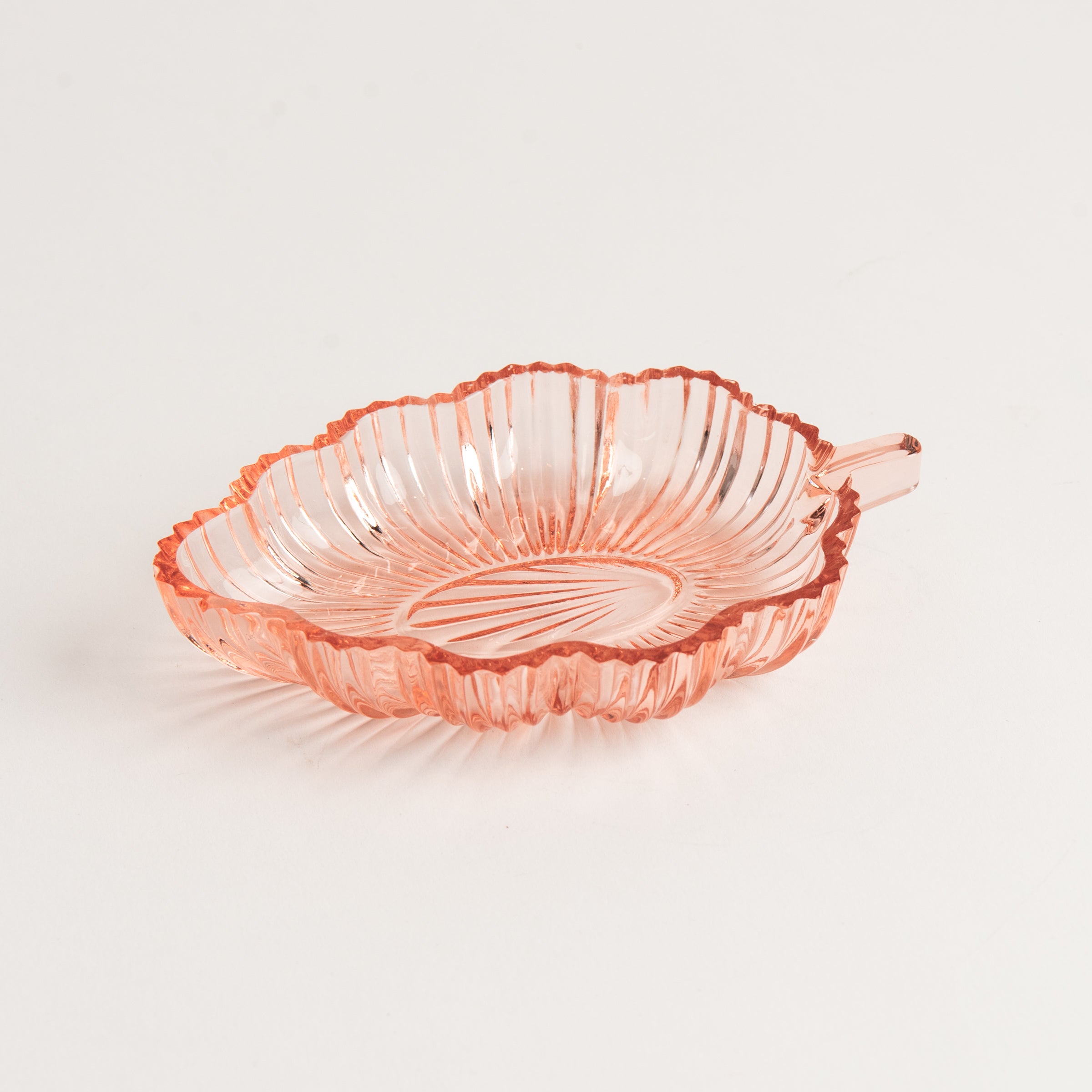 Vintage 30s Glass Leaf Dish in Blush on a white background at Addison West