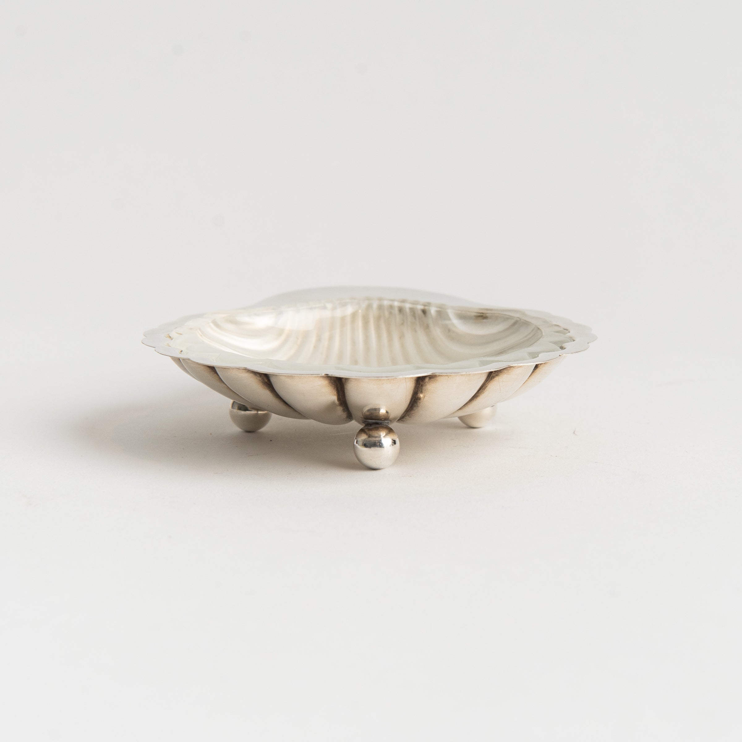 Vintage French Silver Shell Tray with Glass Insert on a white background at Addison West