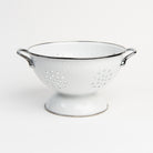 Large White Enamelware Colander on a white background at Addison West