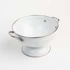 Large White Enamelware Colander on a white background at Addison West