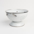 Medium White Enamelware Colander on a white background at Addison West