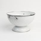 Medium White Enamelware Colander on a white background at Addison West