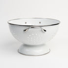 Medium White Enamelware Colander on a white background at Addison West