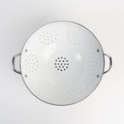 Medium White Enamelware Colander on a white background at Addison West