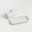 White Porcelain Butter Dish with Knob Handle on a white background at Addison West