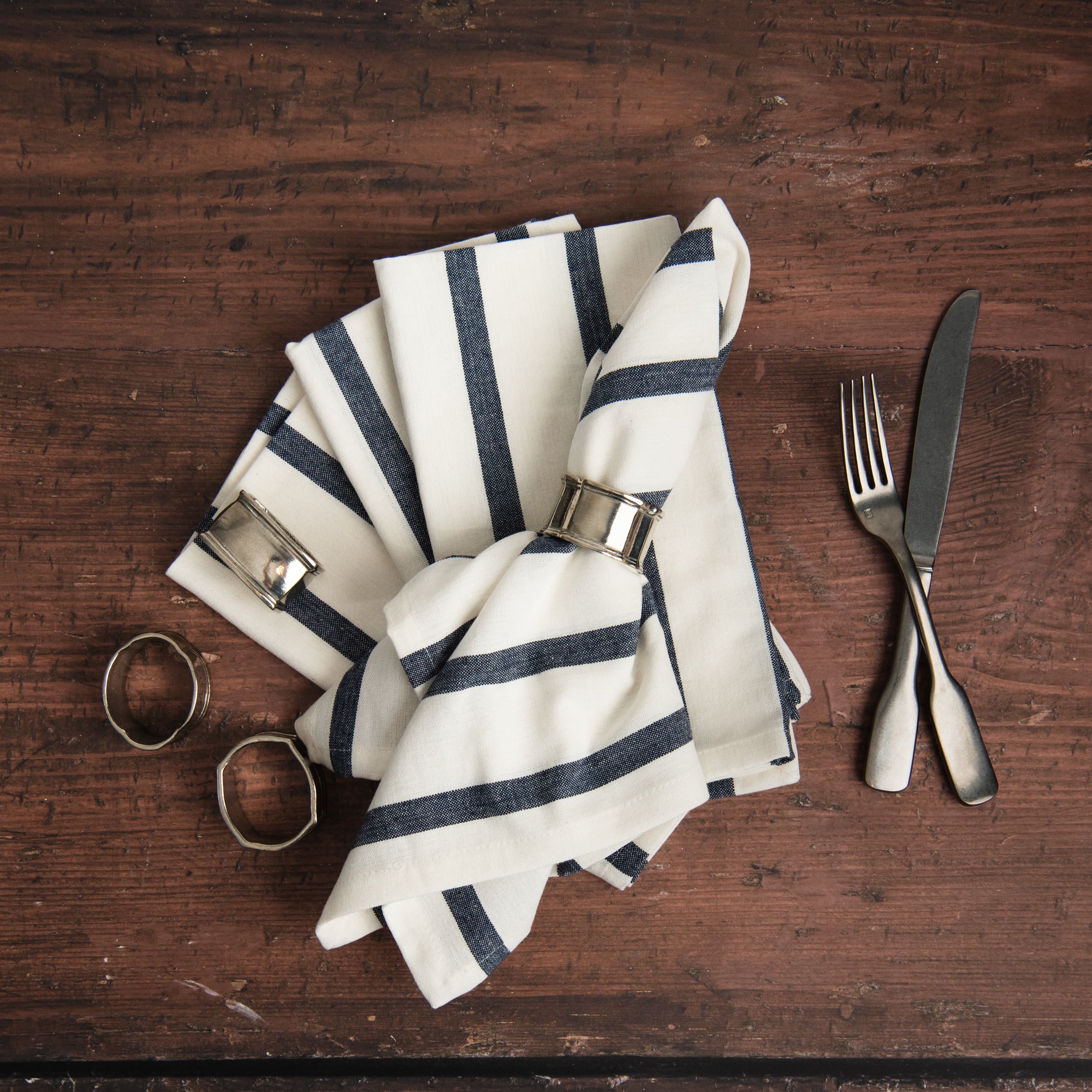 Denim Blue Striped Napkins, Set of 4 on a table at Addison West