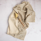 Farmstand Cotton Tea Towel on a marble table at Addison West