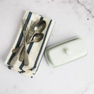 Denim Blue Striped Napkins, Set of 4 on a table at Addison West