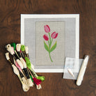 Tulips Needlepoint Kit on a table at Addison West