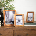 The Classic Wood and Brass Picture Frame on a table at Addison West