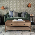 Lina Linen 24" Square Pillow and  in Steel Grey and Astra Blue 22" Square Pillow on a green sofa at Addison West