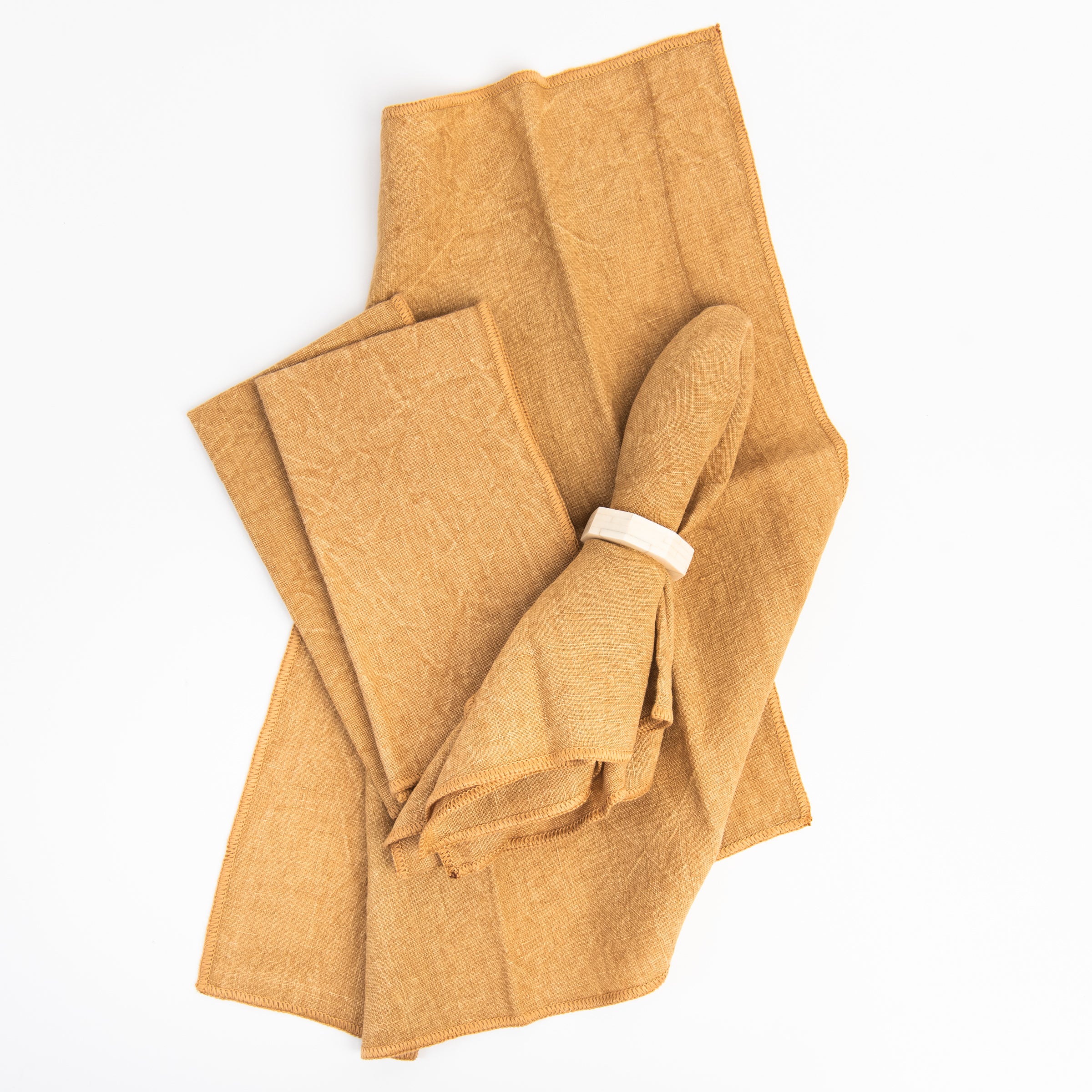 Stonewash Clay Linen Napkins, Set of 4 on a white background at Addison West