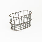Wire Basket Lotion & Soap Bottle Holder on a white background at Addison West