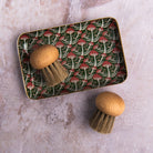 Redecker Mushroom Brush on a table at Addison West