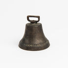 Vintage Bronze Colonial Bell on a white background at Addison West
