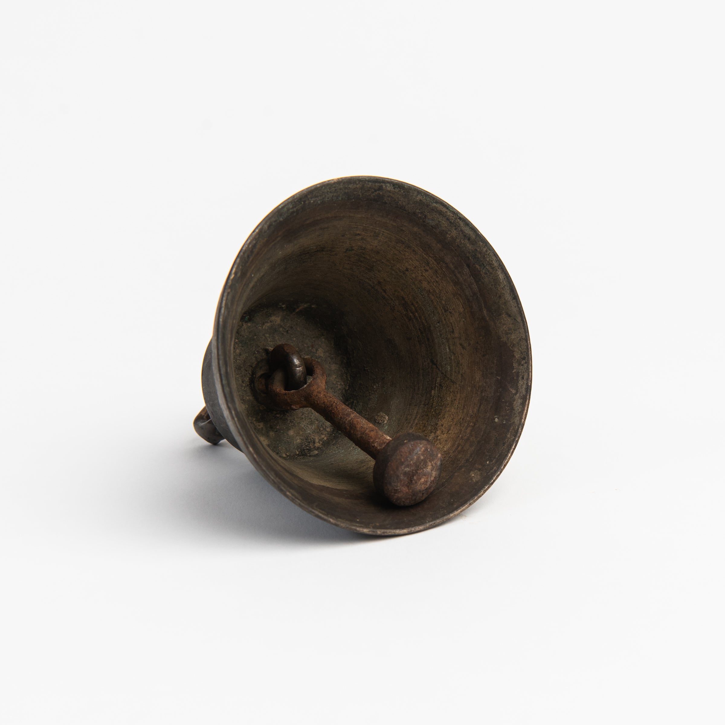 Vintage Bronze Colonial Bell on a white background at Addison West