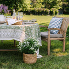 Elowen Block Print Tablecloth on a table outside at Addison West