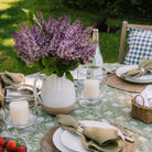 Farmhouse Pottery Farmer's Pitcher on a table outside at Addison West