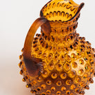 Hobnail Glass Pitcher in Saffron Light on a white background at Addison West