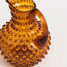 Hobnail Glass Pitcher in Saffron Light on a white background at Addison West