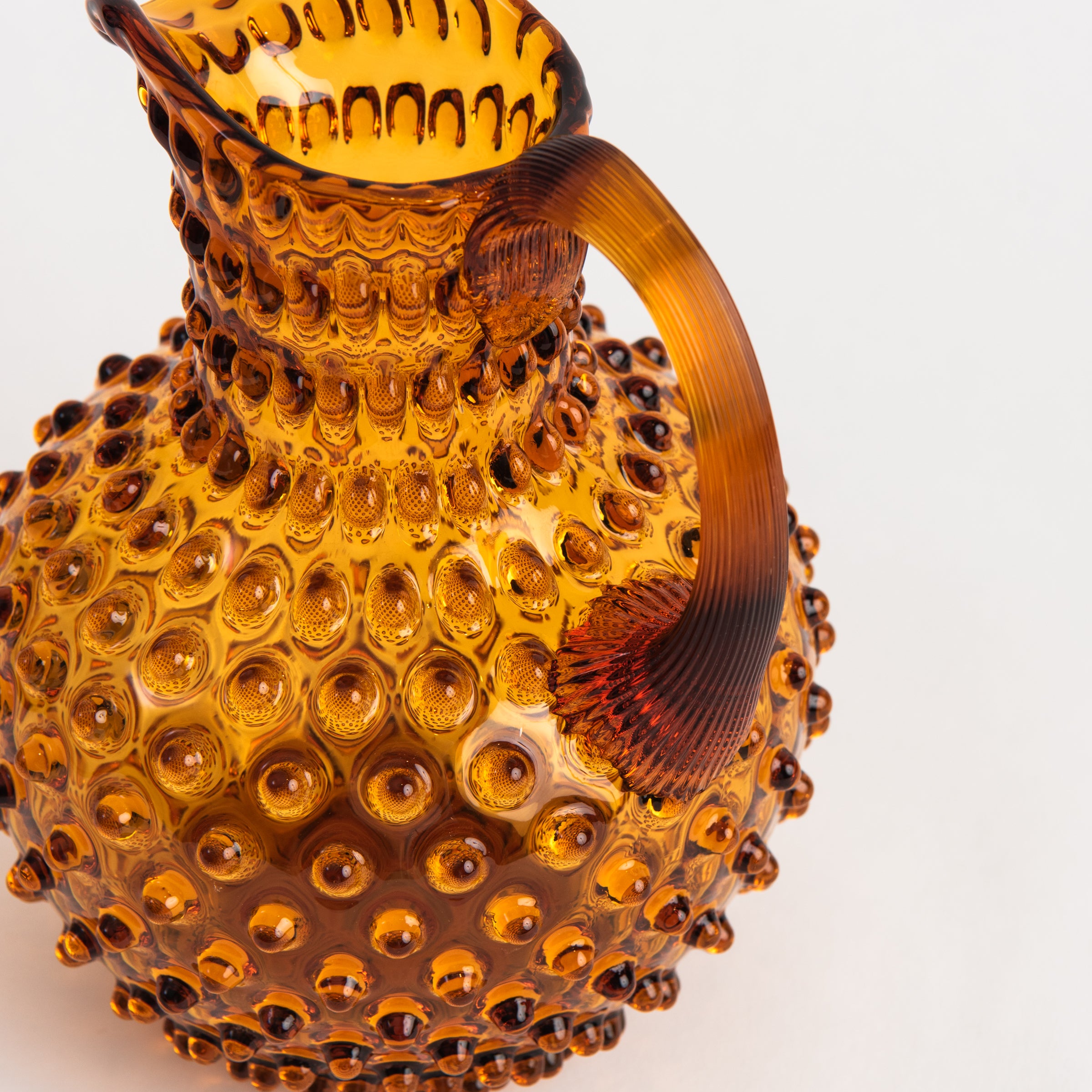 Hobnail Glass Pitcher in Saffron Light on a white background at Addison West