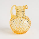 Hobnail Glass Pitcher, Limoncello on a white background at Addison West