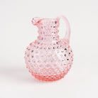 Hobnail Glass Pitcher in Petal Pink on a white background at Addison West